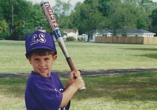 An image of Gardin, Gavin's Older brother, holding a baseball bat.