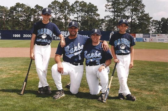 An image of Glenn and Raissa's children in Baseball Uniforms