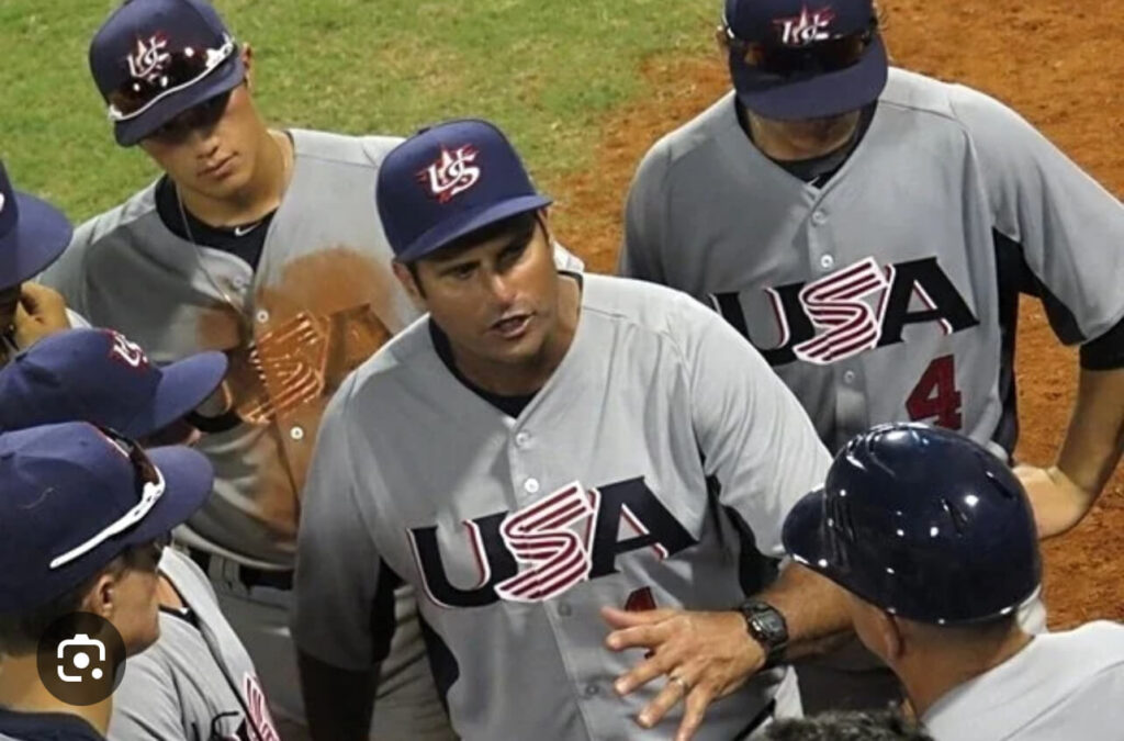 An image of a baseball team huddled up together