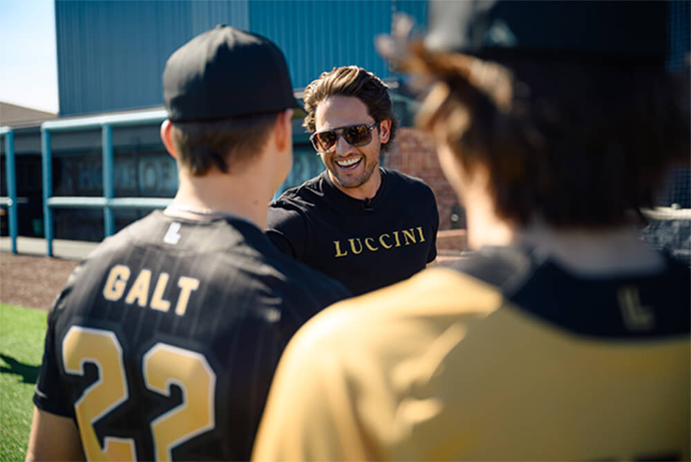 An image of Luccini players and gavin on a baseball field.